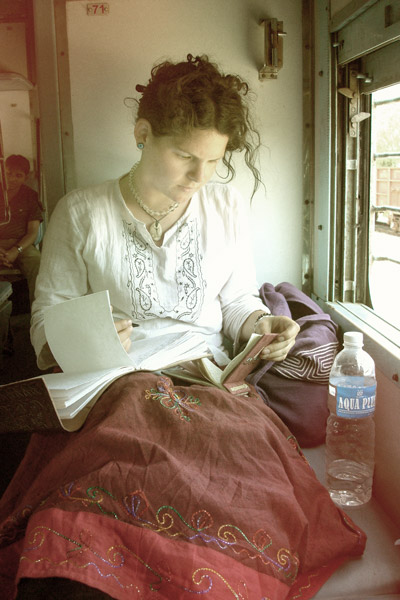 Rebecca writing her journal while travelling in India